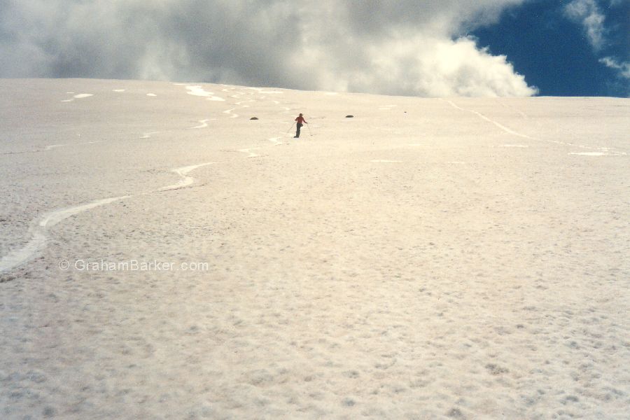 one skier on a late spring snow patch, Ramshead Range, NSW Snowy Mountains